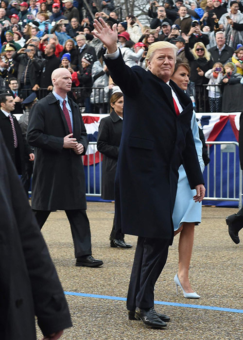 832310244_US-President-Donald-Trump-walks-his-wife-Melania-surrounded-by-secret-service-officers-outs.jpg